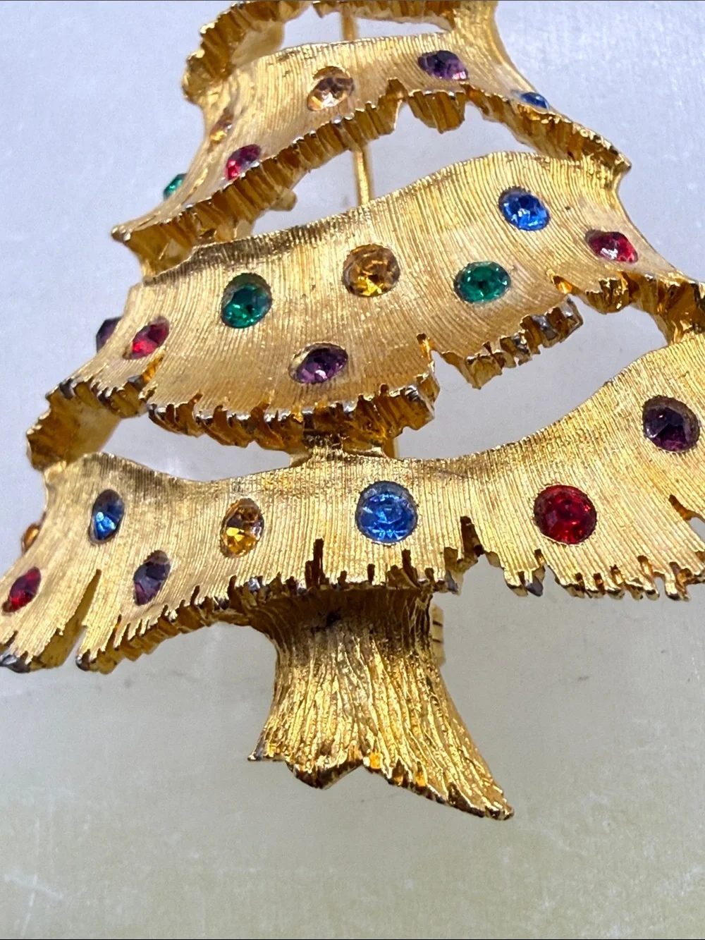 Vintage JJ Gold-tone Christmas Tree Pin with Multicolored Rhinestones
